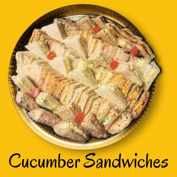 Platter of cucumber sandwiches with fresh, sliced cucumbers on soft bread, typically served as a light tea snack.