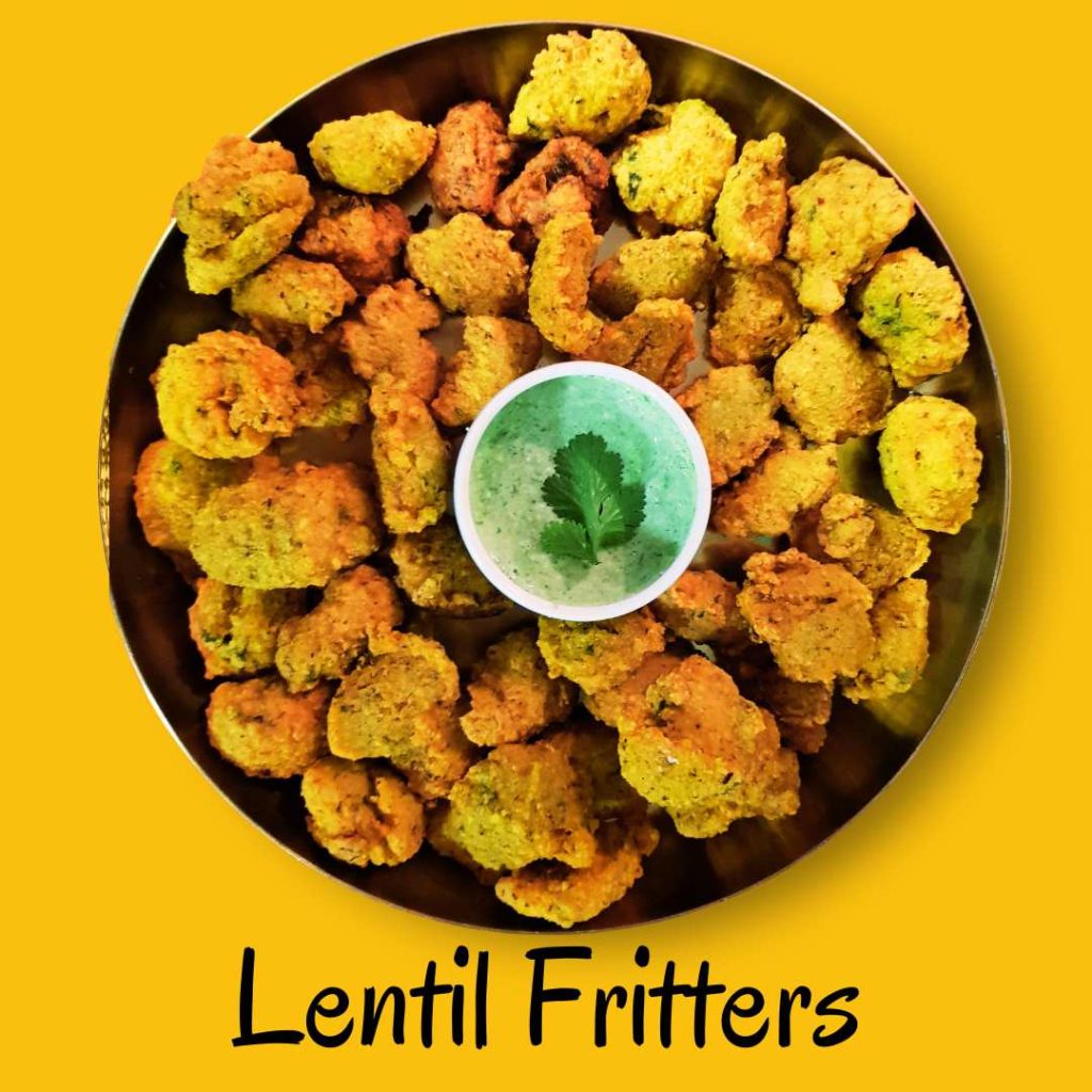 Platter of dal vada, crispy lentil fritters served as a savory Indian snack, accompanied by chutneys