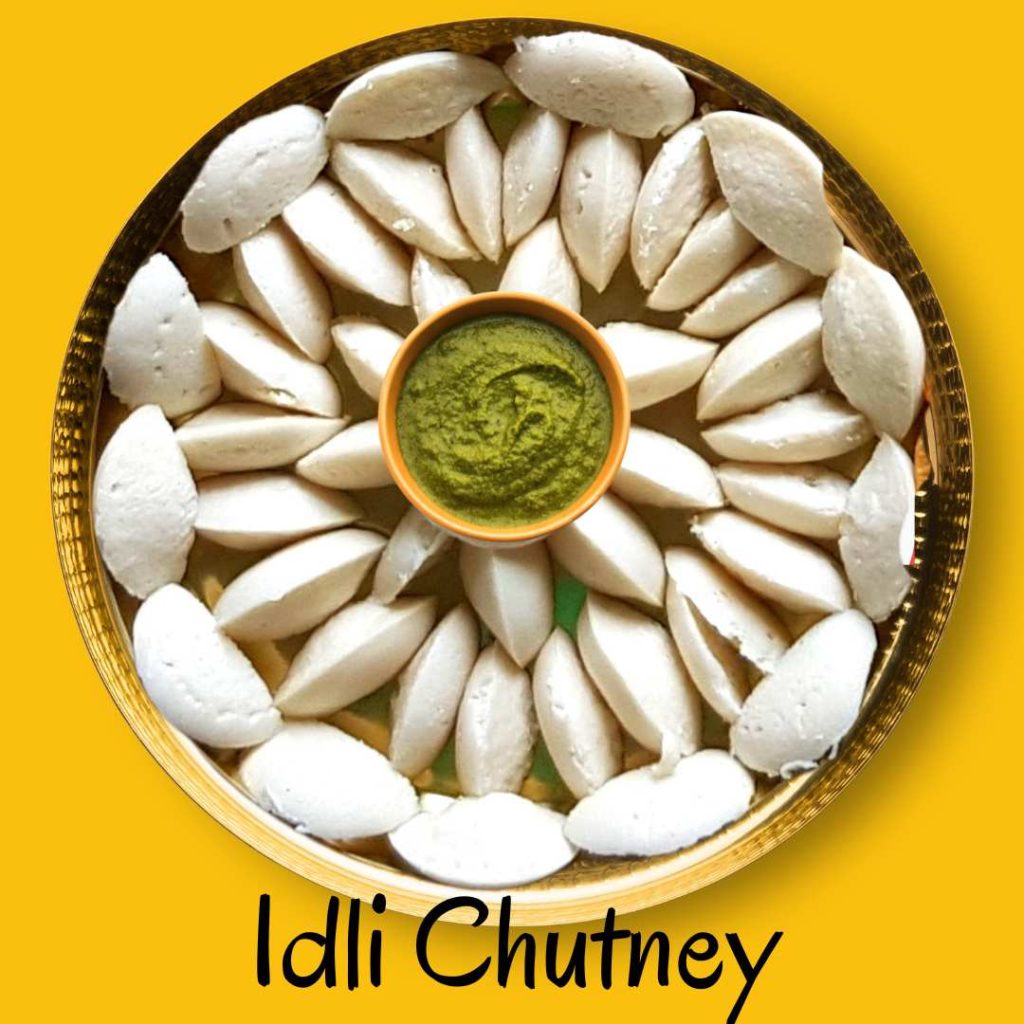 Platter of soft idli rice cakes served with a variety of chutneys, showcasing a traditional South Indian meal